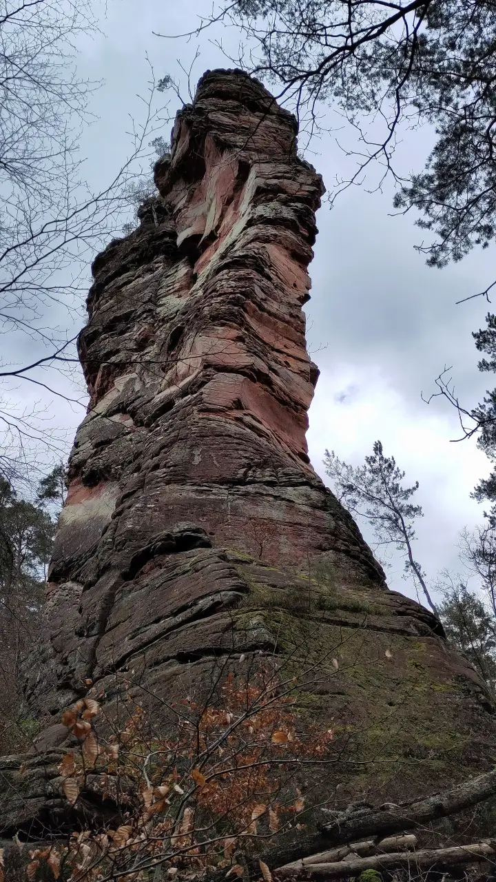A massive rock needle stretches towards the sky